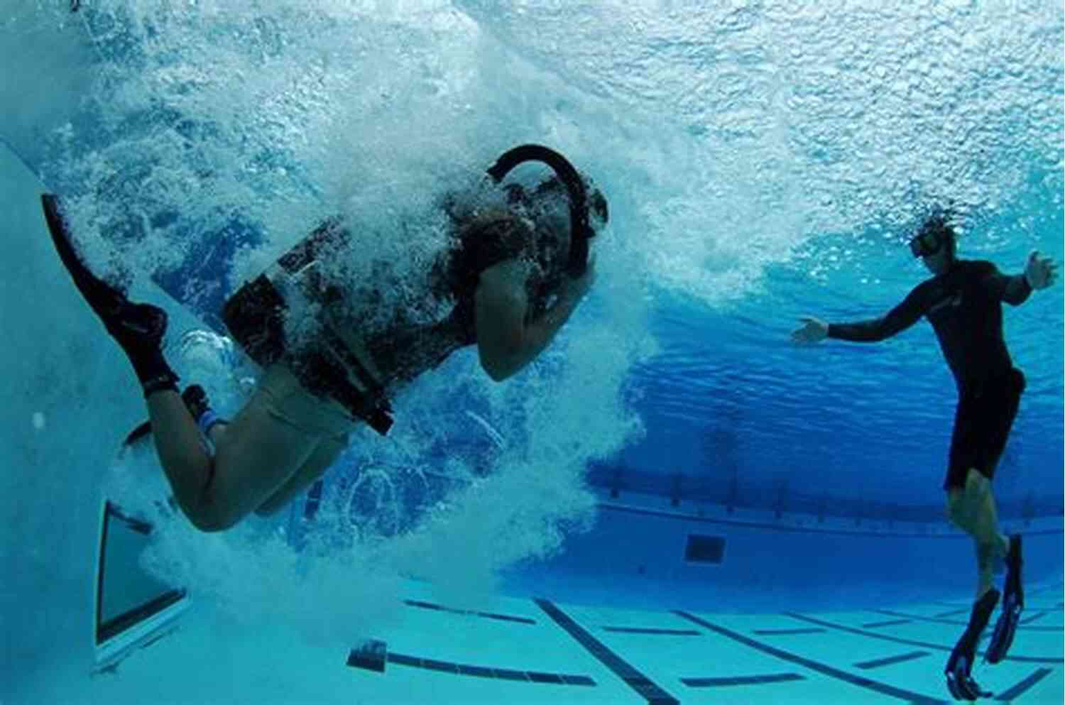 Navy Seals Training Demonstrating Water Survival Skills During BUD/S Physical Training In The United States Navy Seals: Everything You Need To Know About The Navy Seals Fitness Training